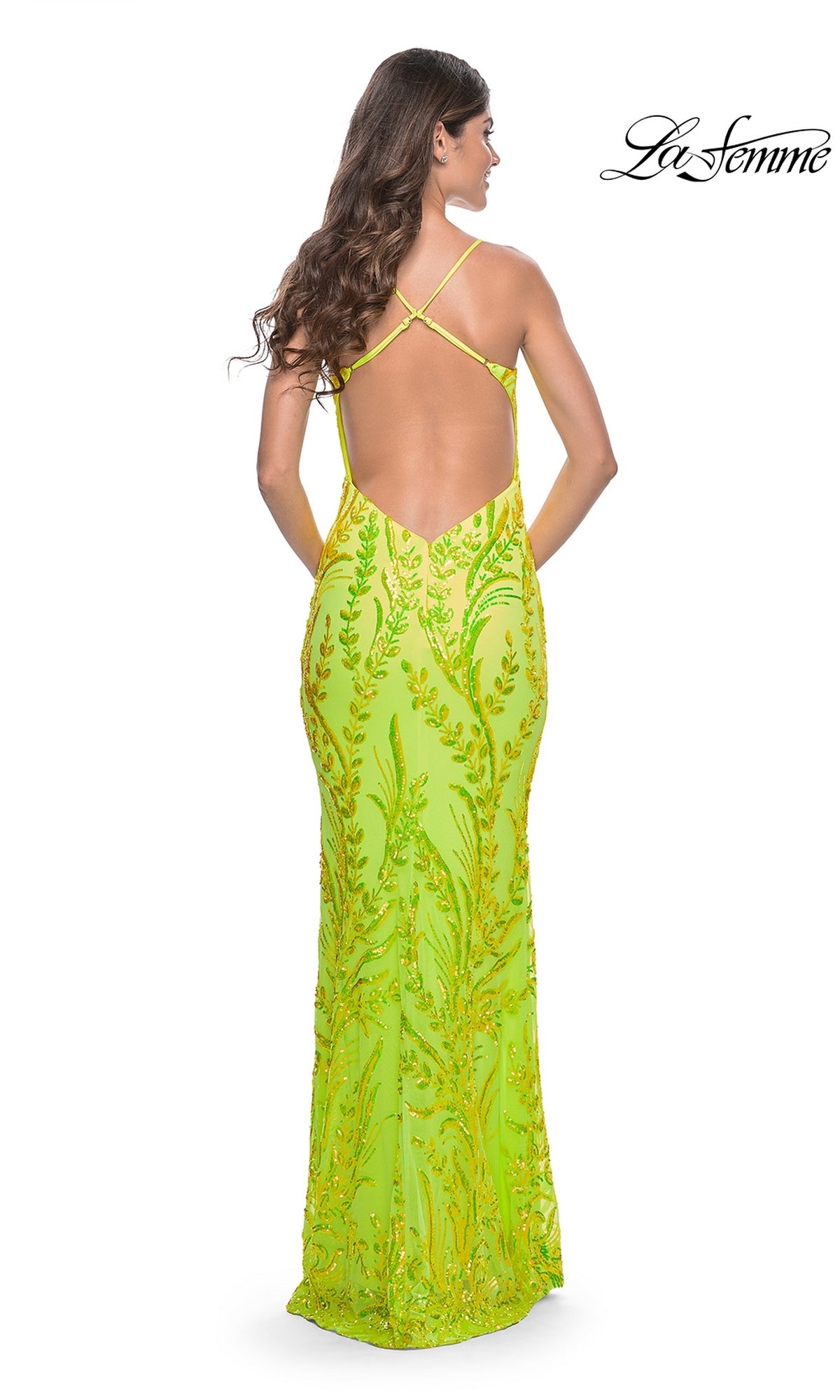 A woman wears the La Femme Bright Long Sequin-Print Prom Dress 32343, featuring a vibrant yellow-green color, an open crisscross back, and shimmering sequins. The La Femme logo appears in the top right corner.